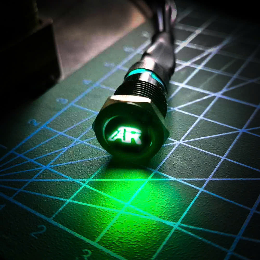 Push button switch actuator with LED